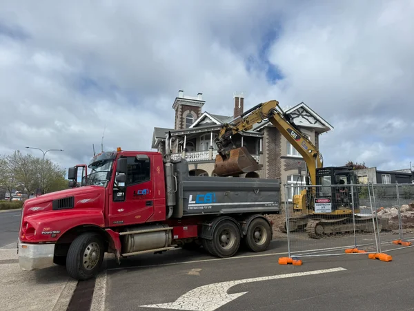LCB tip truck and CAT excavator on a heritage building demolition