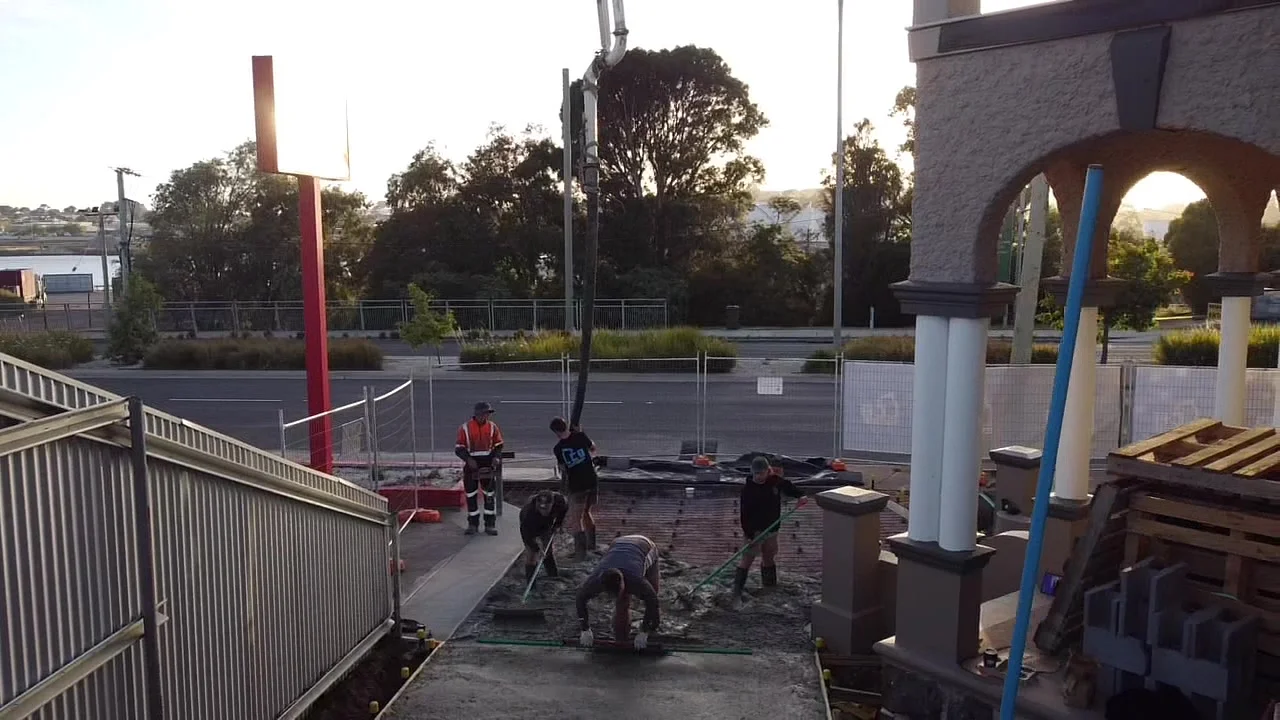 LCB crew screeding a fresh concrete driveway pour in Launceston