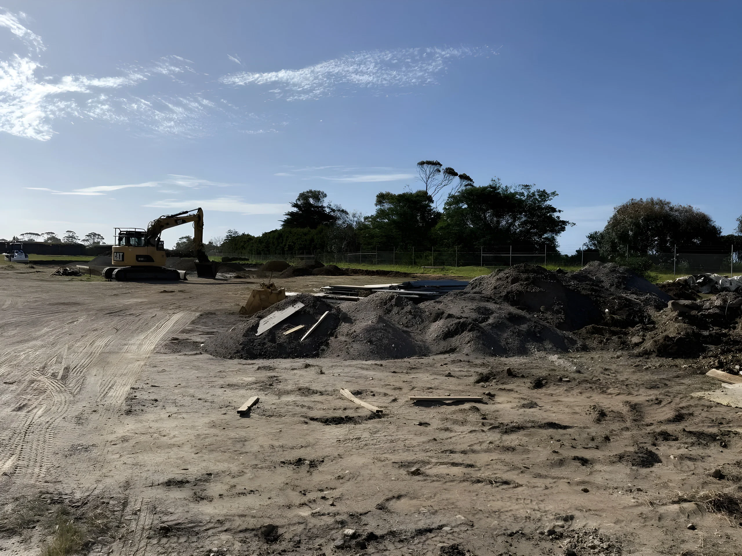 LCB Contracting CAT excavator carrying out bulk earthworks on a commercial site in North West Tasmania