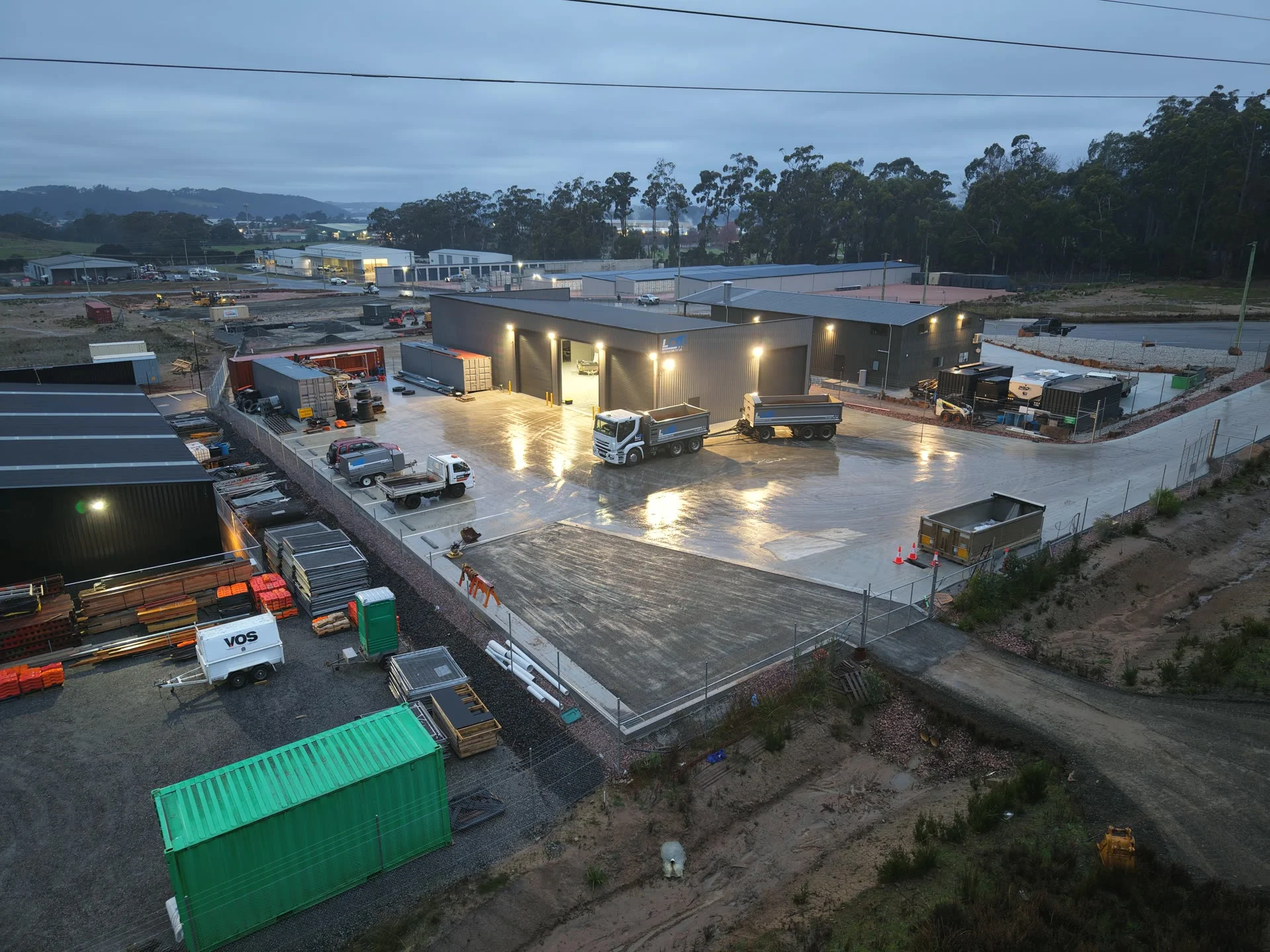Aerial view over the works, hardstands and sheds at dawn